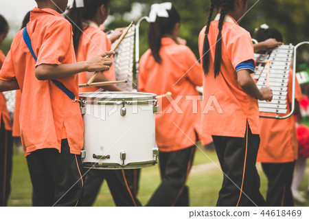 Marching band drummers perform in school parade Marching band drummers perform in school parade 44618469
