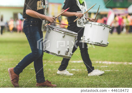 Marching band drummers perform in school parade Marching band drummers perform in school parade 44618472