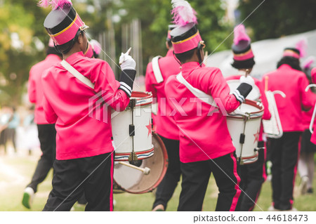 Marching band drummers perform in school parade Marching band drummers perform in school parade 44618473