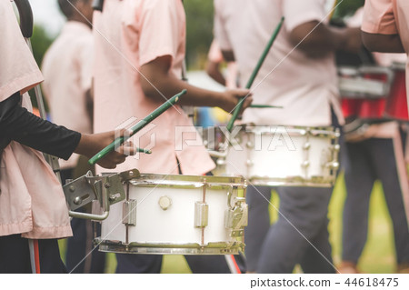Marching band drummers perform in school parade Marching band drummers perform in school parade 44618475