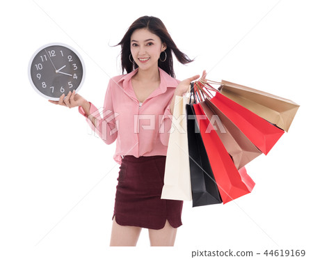 happy woman holding shopping bag and clock isolate on white back happy woman holding shopping bag and clock isolate on white back 44619169