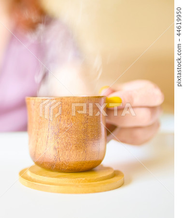 Woman drink coffee in bed 44619950
