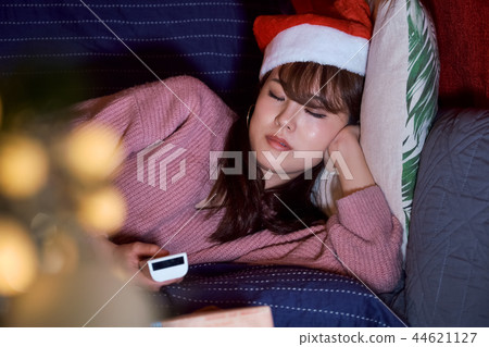 Woman spending christmas Woman spending christmas 44621127