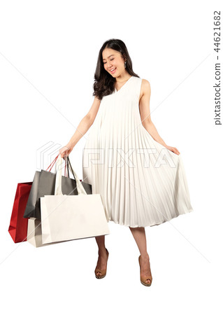 Shopaholic woman with a shopping bags Shopaholic woman with a shopping bags 44621682