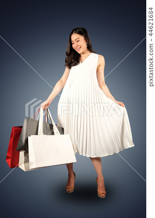 Shopaholic woman with a shopping bags 44621684