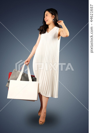 Shopaholic woman with a shopping bags Shopaholic woman with a shopping bags 44621687