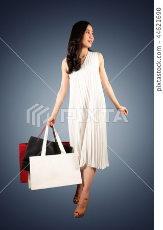 Shopaholic woman with a shopping bags Shopaholic woman with a shopping bags 44621690