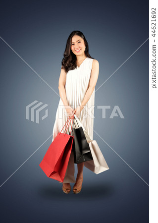 Shopaholic woman with a shopping bags Shopaholic woman with a shopping bags 44621692