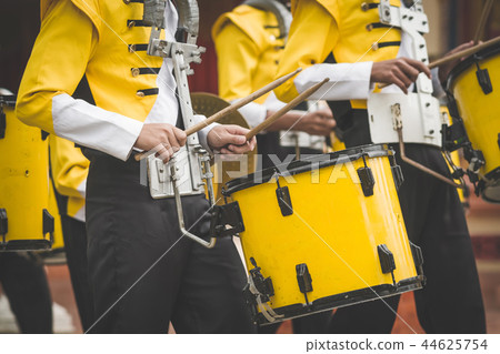 Marching band drummers perform in school parade Marching band drummers perform in school parade 44625754