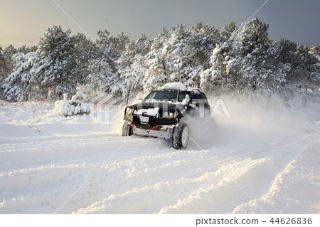SUV on snow 44626836