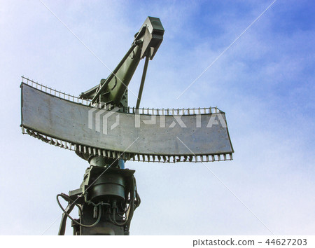 Green Military radar station against blue sky 44627203