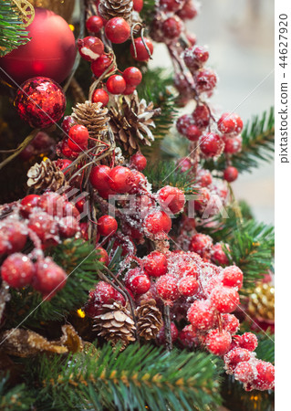 Christmas tree with red and golden flower decors. Christmas tree with red and golden flower decors. 44627920