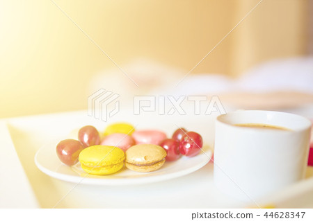 Romantic breakfast with macarons and coffee Romantic breakfast with macarons and coffee 44628347