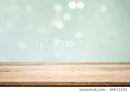 Wooden table with mint bokeh abstract background. Wooden table with mint bokeh abstract background. 44631242