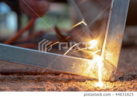 Technician focus on welding process on spark light 44631625