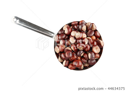 Many chestnuts in frying pan. Isolated Many chestnuts in frying pan. Isolated 44634375