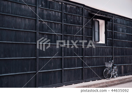 Japanese vintage bicycle and black wooden wall 44635092