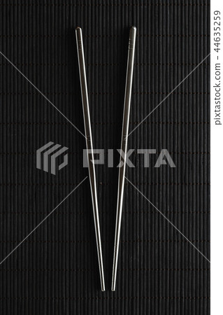 Pair of chopsticks on white background 44635259