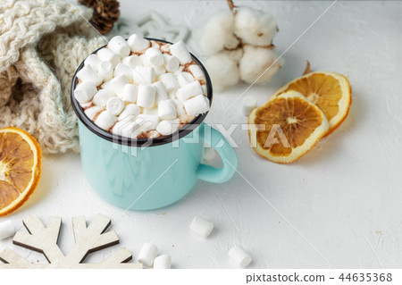 Mug of cocoa with marshmallows and winter decor Mug of cocoa with marshmallows and winter decor 44635368