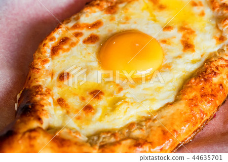 Ajarian khachapuri Georgian cheese pie with egg close Ajarian khachapuri Georgian cheese pie with egg close 44635701