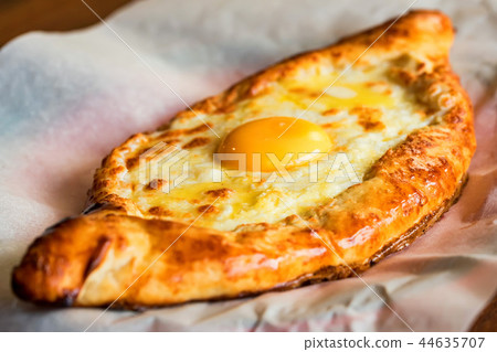 Ajarian khachapuri Georgian cheese pie with egg close 44635707