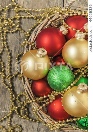 Christmas balls red, gold, green, beads lie in Christmas balls red, gold, green, beads lie in 44636326