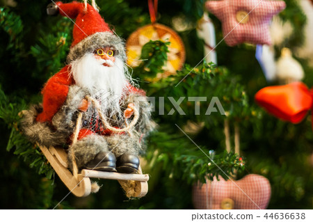 Santa Claus on a sledge toy on Christmas tree Santa Claus on a sledge toy on Christmas tree 44636638