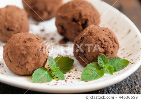 dessert truffles sprinkled with cocoa and mint dessert truffles sprinkled with cocoa and mint 44636659