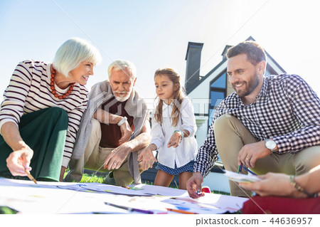 Joyful mature woman taking to her son Joyful mature woman taking to her son 44636957