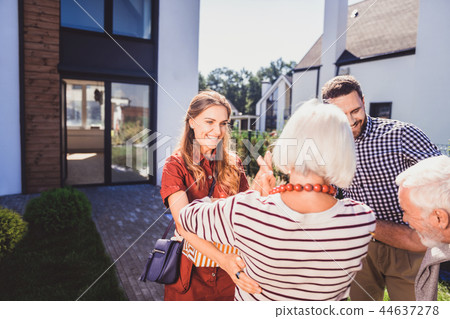 Positive delighted people meeting together at home Positive delighted people meeting together at home 44637278
