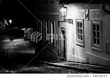 Narrow cobbled street in old medieval town with illuminated houses by vintage street lamps, Novy Narrow cobbled street in old medieval town with illuminated houses by vintage street lamps, Novy 44638243