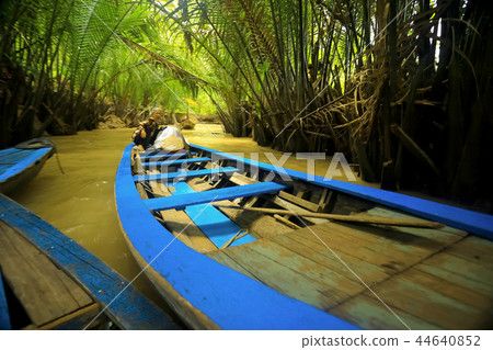 Boat sailing along the river 44640852