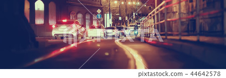 view of car in traffic jam / rear view of the landscape from window in car, road with cars, lights and the legs of the cars night view view of car in traffic jam / rear view of the landscape from window in car, road with cars, lights and the legs of the cars night view 44642578