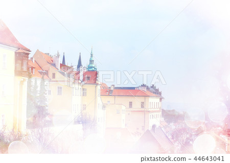 pink Prague background and red roofs / background of the blurred landscape of the czech republic, Prague, panoramic view of the red roofs of Prague pink Prague background and red roofs / background of the blurred landscape of the czech republic, Prague, panoramic view of the red roofs of Prague 44643041