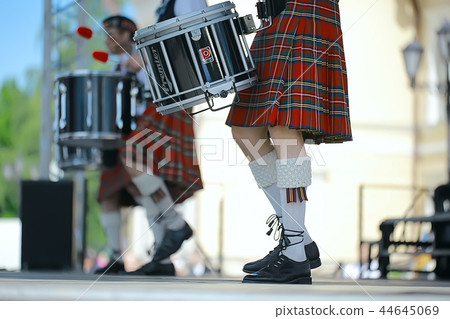 feet in Scottish skirts, the Scottish National Orchestra plays on St. Patrick's Day, holiday costumes for men 44645069
