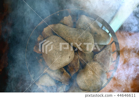 sauna stones / hot stones for water supply, steam on the stones in the sauna, spa concept, hot relaxation 44646611