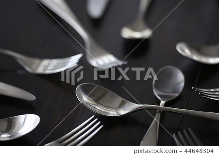 fork spoons knives background / beautiful serving tableware 44648304