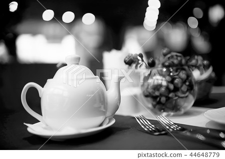 English tea in a cafe / cup and kettle with five o'clock tea 44648779
