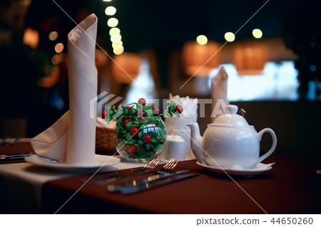 English tea in a cafe / cup and kettle with five o'clock tea 44650260