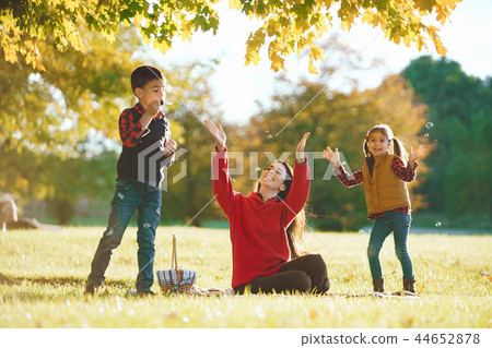 Beautiful mother with little kids Beautiful mother with little kids 44652878