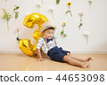 Posing boy holding 44653098
