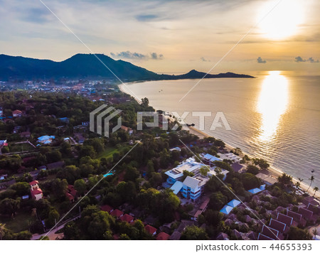 Aerial view of beautiful tropical beach and sea with palm and other tree in koh samui island Aerial view of beautiful tropical beach and sea with palm and other tree in koh samui island 44655393