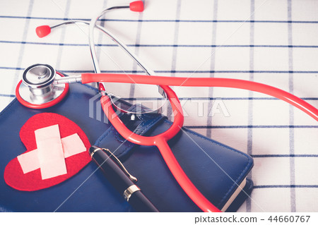 healthcare and medical concept red stethoscope healthcare and medical concept red stethoscope 44660767