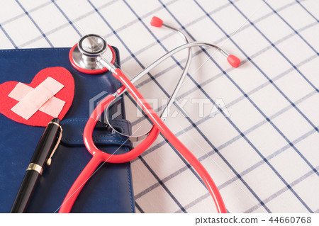 healthcare and medical concept red stethoscope healthcare and medical concept red stethoscope 44660768