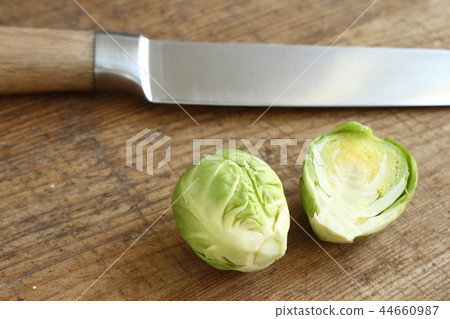 fresh brussels sprouts on a wooden board 44660987