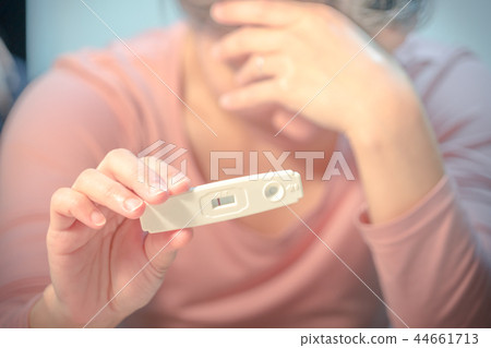 negative pregnancy test result held on cry woman negative pregnancy test result held on cry woman 44661713