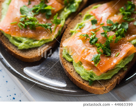 Rye bread avocado toasts with smoked salmon 44663399