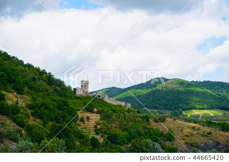 Mountains on Danube beach and castle ruins. 44665420