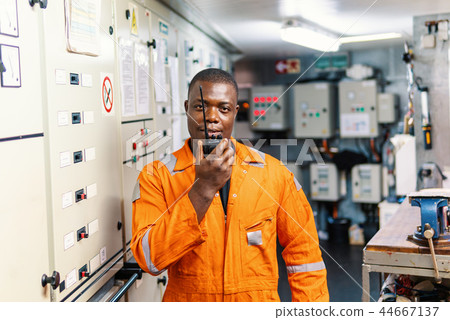 Marine engineer officer working in engine room Marine engineer officer working in engine room 44667137
