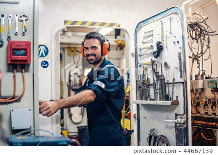 Marine engineer officer working in engine room 44667139